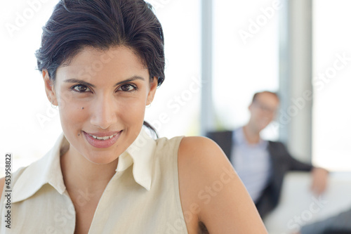 Businesswoman smiling on sofa Free Download Businesswoman smiling on sofa - GFXLoad