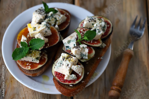 Delicious toast with gorgonzola cheese and figs. Healthy snack. Keto toast. photo