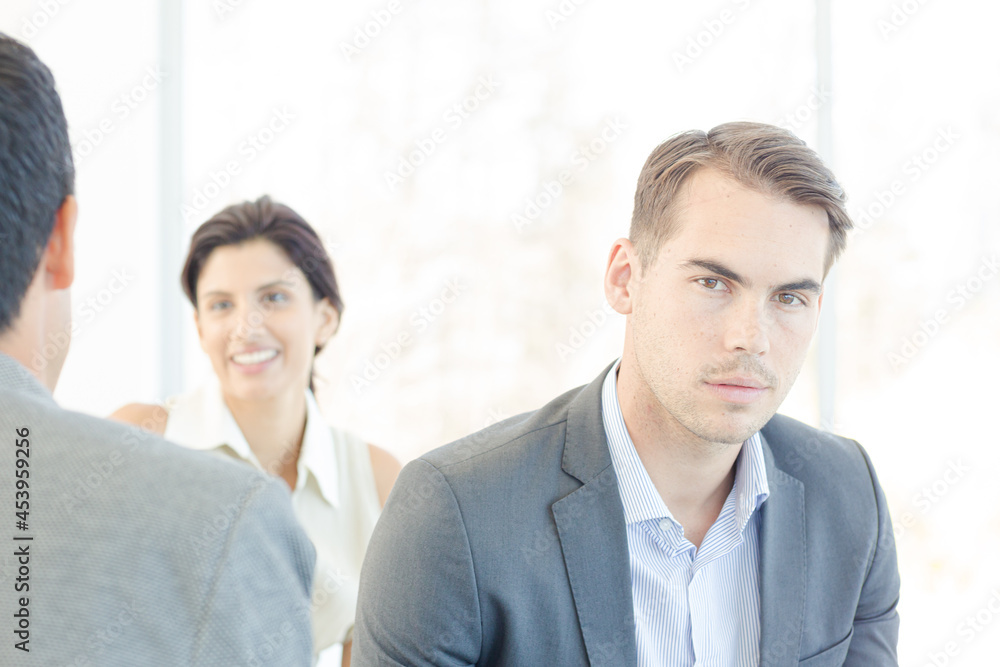 Businessman using cell phone in office Businessman using cell phone in office