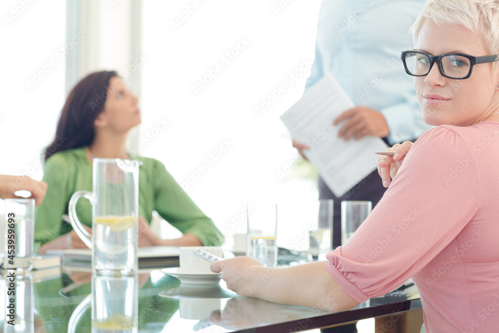 Businesswoman sitting in meeting Businesswoman sitting in meeting