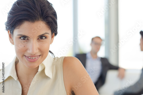 Businesswoman smiling on sofa
