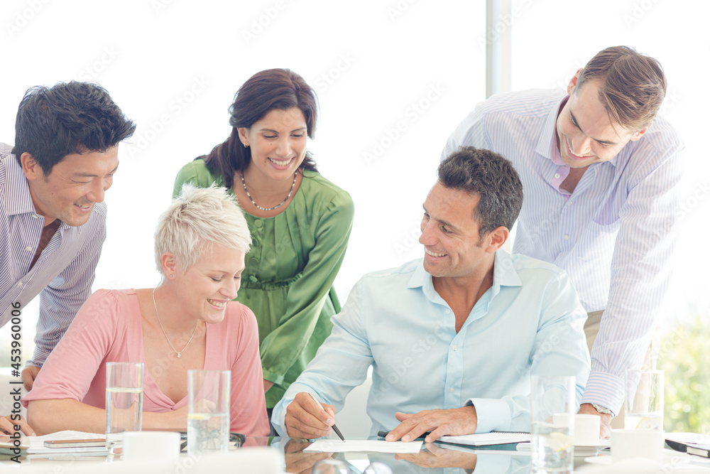 Business people smiling in meeting Business people smiling in meeting