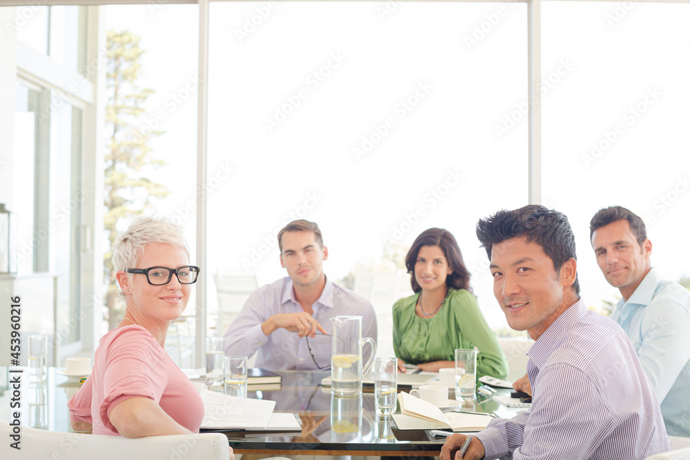 Business people smiling in meeting Business people smiling in meeting