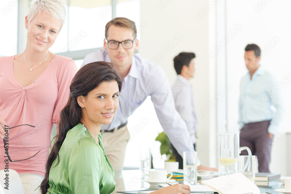 Business people smiling together in office