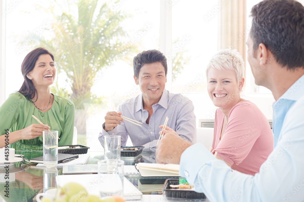 Business people smiling in lunch meeting Business people smiling in lunch meeting
