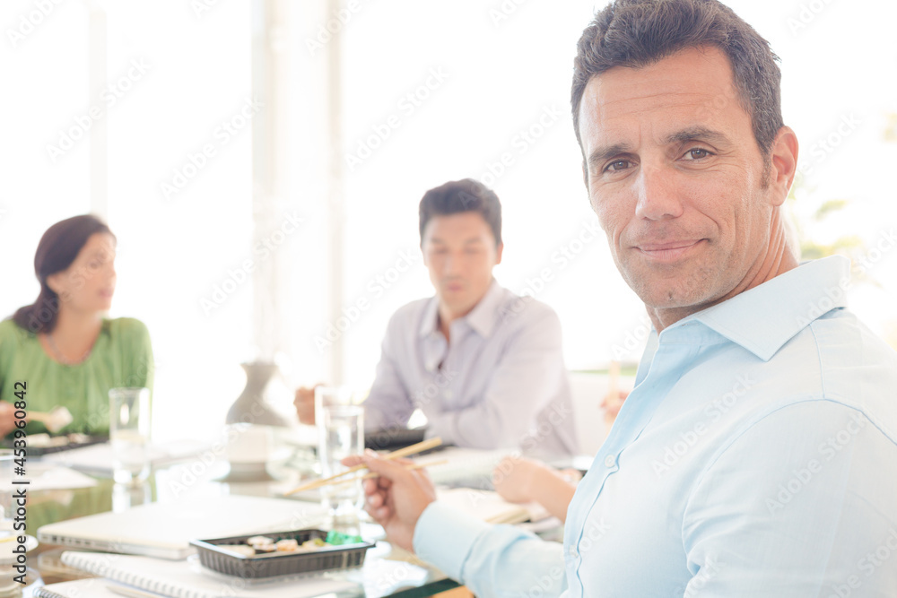 Businessman smiling in lunch meeting Businessman smiling in lunch meeting