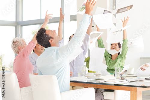 Business people cheering in meeting