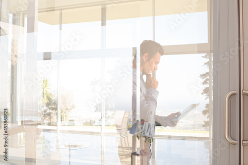 Businessman using tablet computer outdoors Free Download Businessman using tablet computer outdoors - GFXLoad