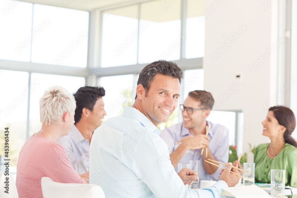 Businessman smiling in meeting Businessman smiling in meeting