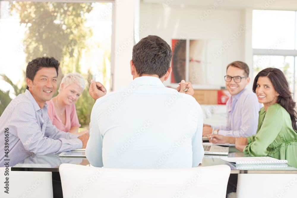 Business people smiling in meeting Business people smiling in meeting