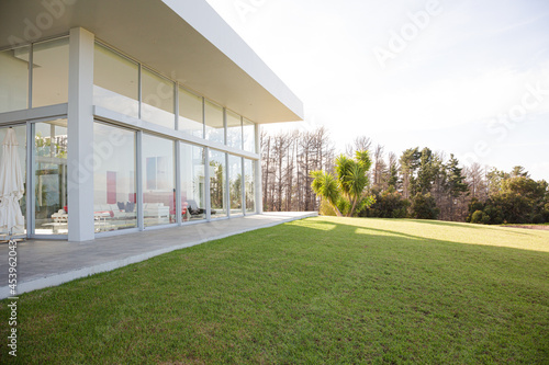 Modern building overlooking manicured lawn © KOTO