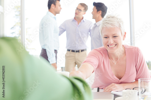 Business people shaking hands in meeting