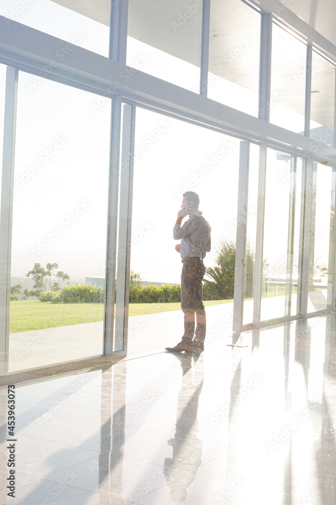 Businessman talking on cell phone outdoors Businessman talking on cell phone outdoors