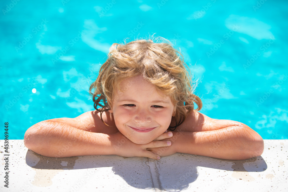 Child in summer swimming pool. Kid relax outdoors. Summer vacation and healthy lifestyle concept.