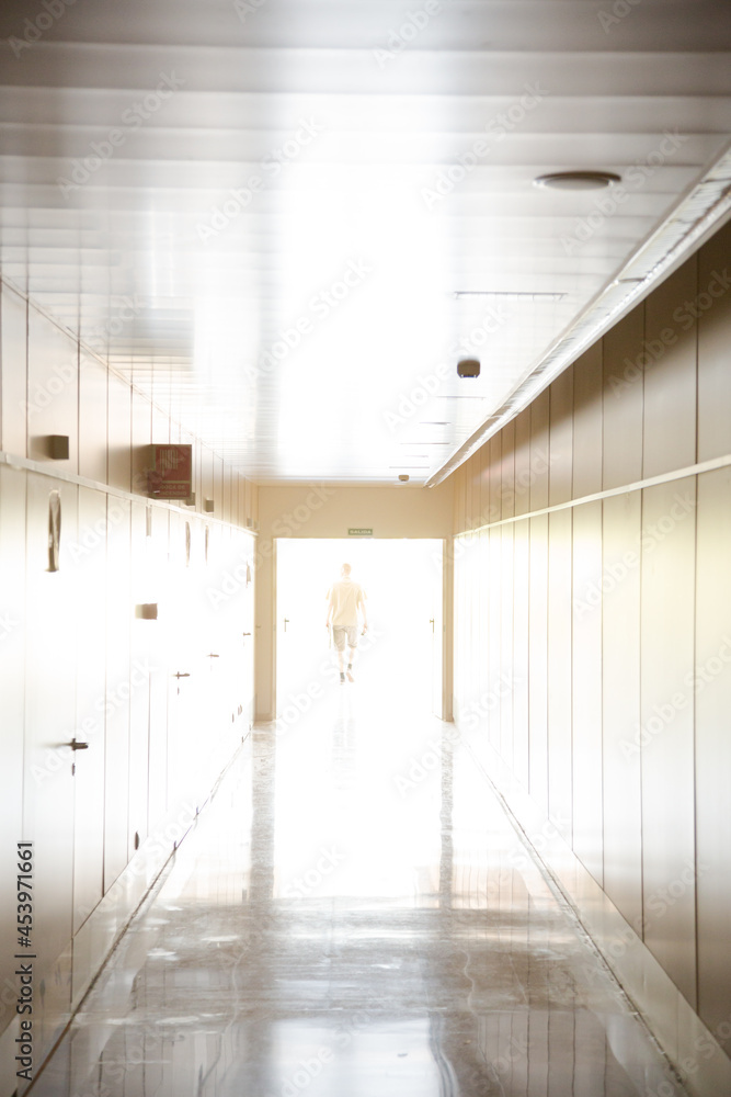 Fototapeta premium Man standing in corridor