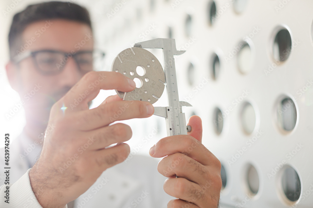 Fototapeta premium Scientist using caliper
