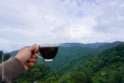 coffee glass of wine in hand photo