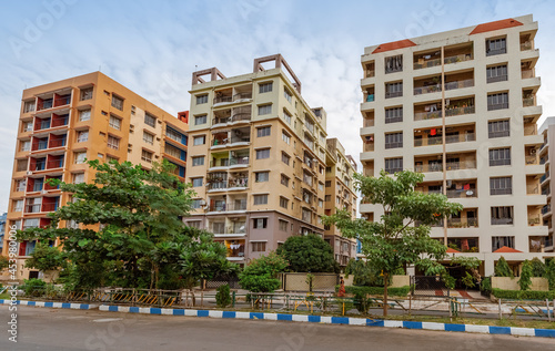 Residential apartment buildings with city road at New Town Kolkata, India photo