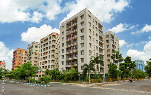 Residential multistory apartment buildings with city road at Rajarhat area of Kolkata India  © Roop Dey
