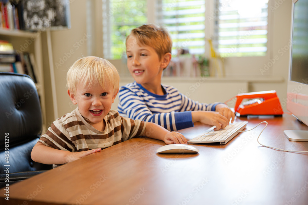 Boys working in home office Boys working in home office
