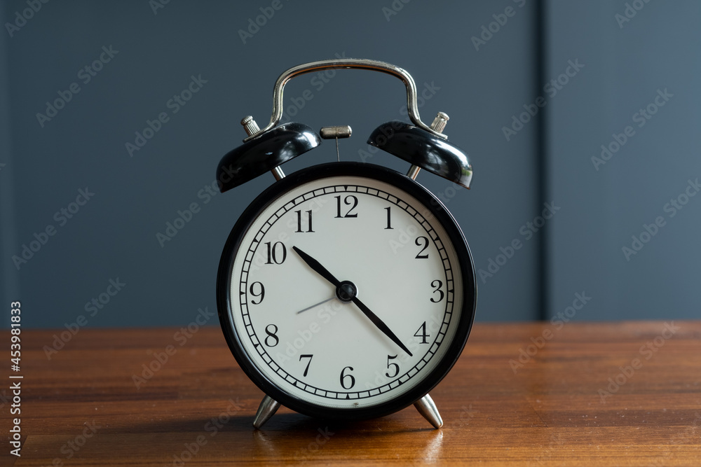 alarm clock on the table with blur background alarm clock on the table with blur background