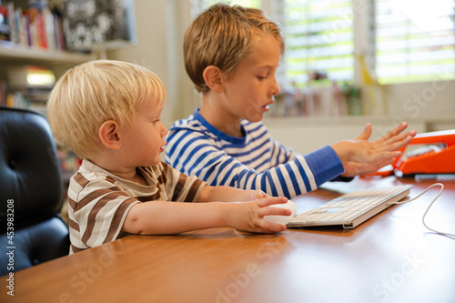 Boys working in home office