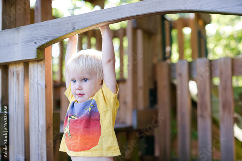 Boy playing on playset outdoors