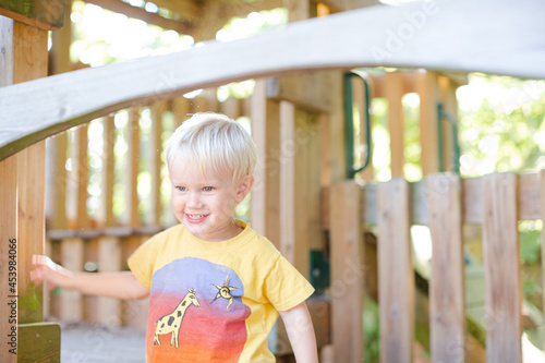 Boy playing on playset outdoors