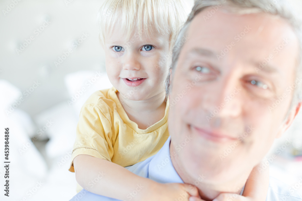 Father and son hugging on bed Father and son hugging on bed