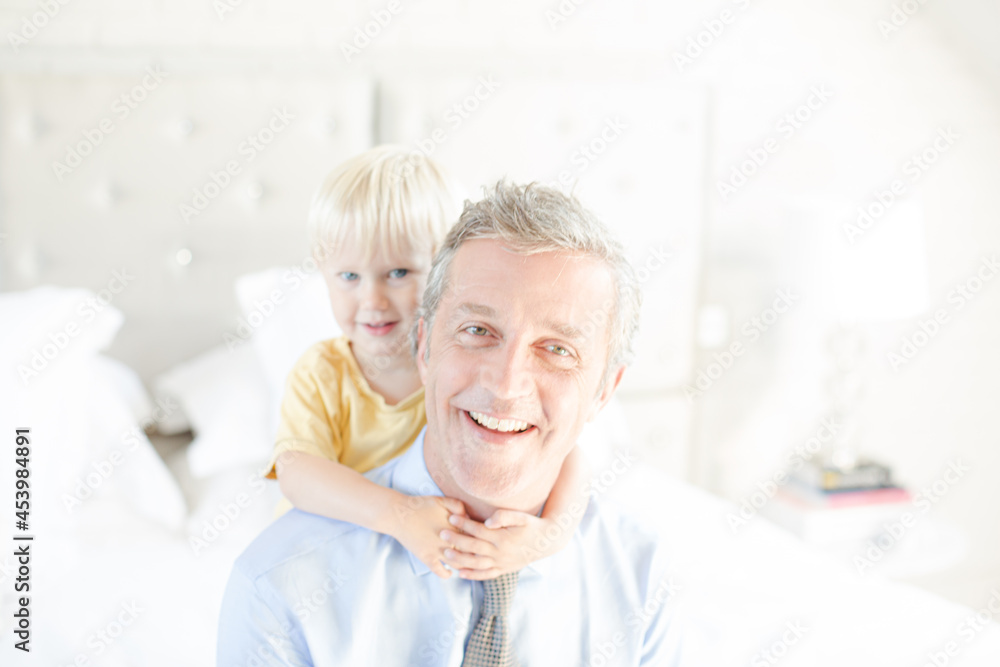 Father and son hugging on bed Father and son hugging on bed