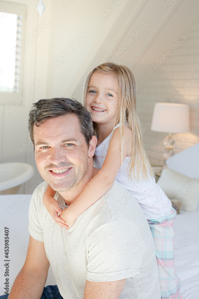 Father and daughter hugging on bed Father and daughter hugging on bed