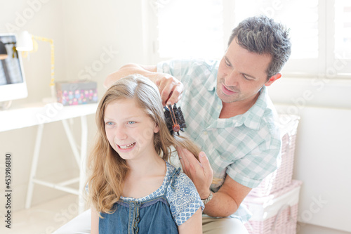 Photography Father combing hair to his daughter