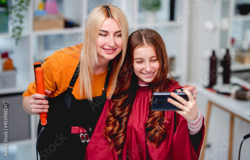 Hairdresser and model making selfie