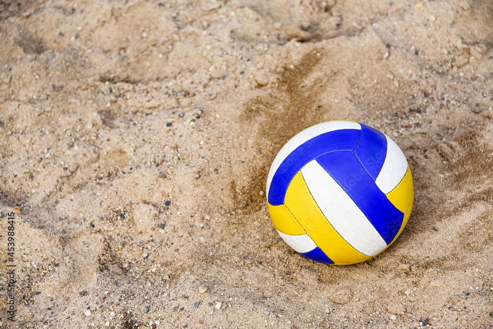 Voleyball on the beach. Collored Ball on the pebble. Close-up. copy space. Summer beach game