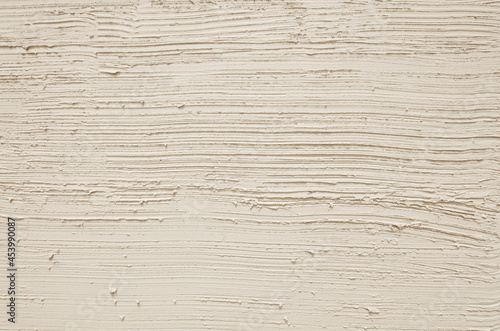 Fototapeta Naklejka Na Ścianę i Meble -  Striped beige plaster wall texture background. Japanese style plaster wall. Beige rough wall stripe texture for backdrop.