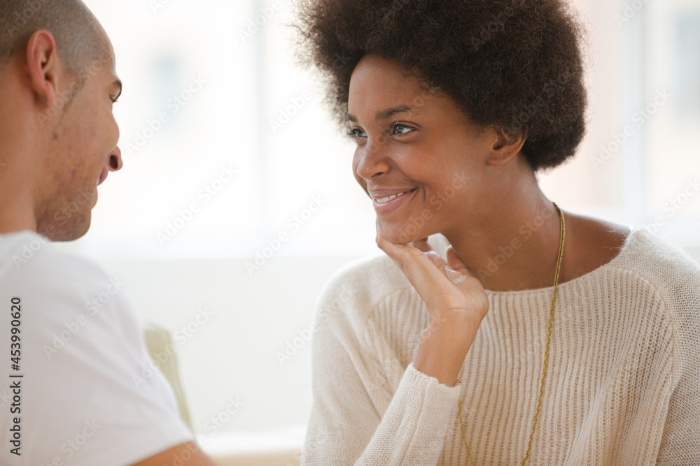 Couple talking indoors Couple talking indoors