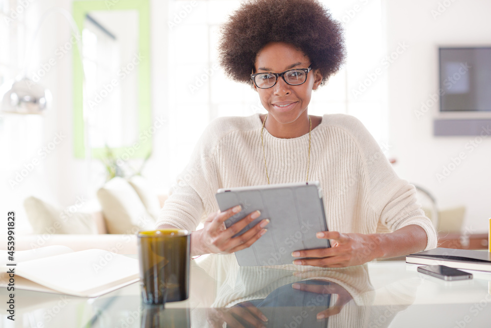 Woman using digital tablet at table Woman using digital tablet at table