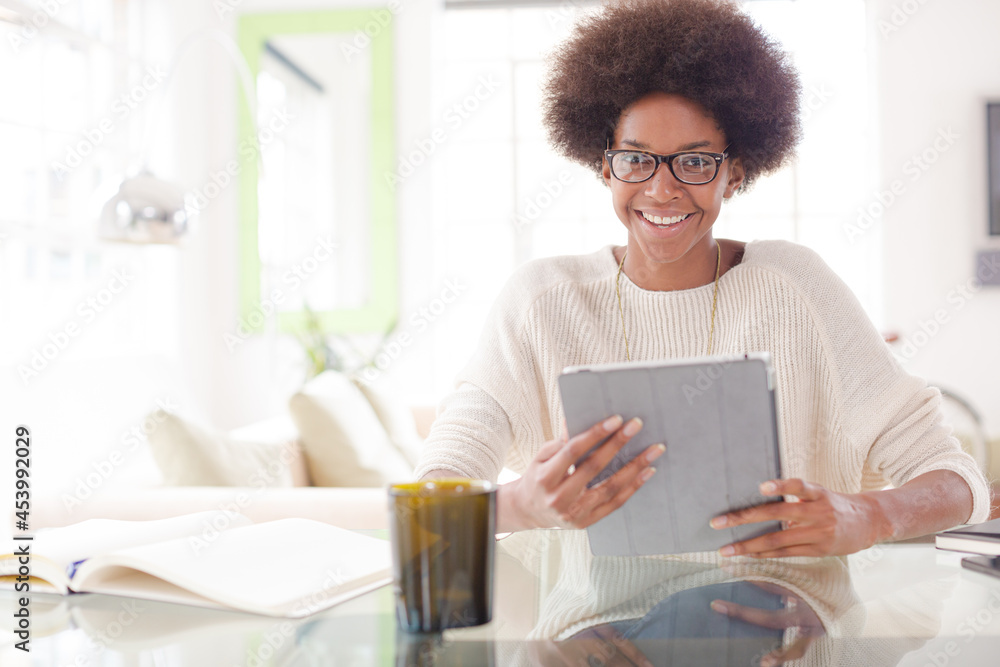 Woman using digital tablet at table Woman using digital tablet at table