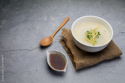 Rice porridge or Congee with fresh ginger and coriander, is a favorite breakfast for south east asian people.