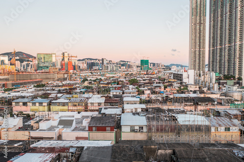 Aerial angle of Colorful messy rooftop on dense old residential house in Kowloon, Hong Kong