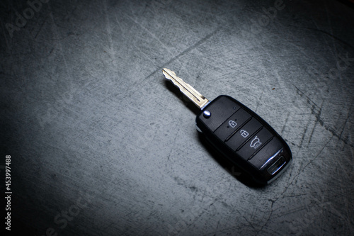 Car key with gray background, unlock