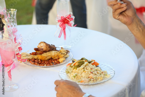 Rice with salad, vegetables, fried chicken and fish