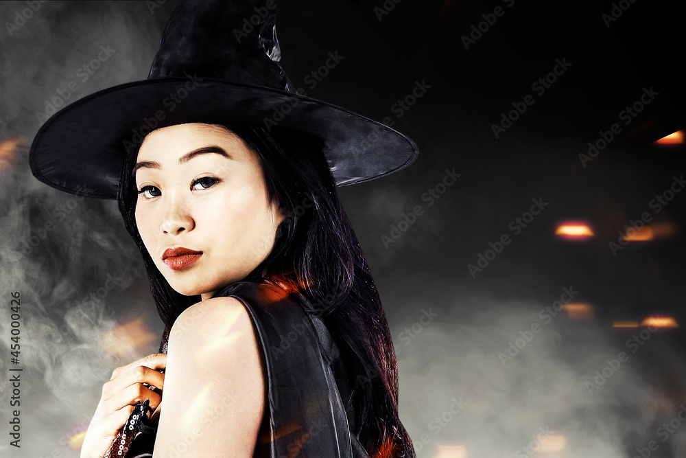 Asian witch woman with a hat standing Asian witch woman with a hat standing