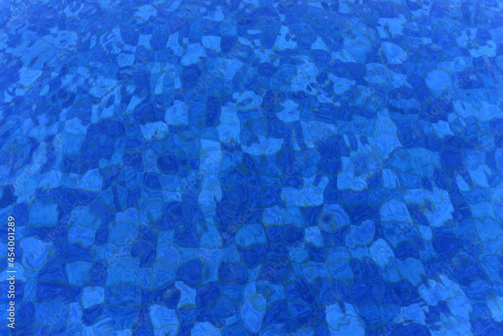 View of a swimming pool with reflections background, can be used as wallpaper