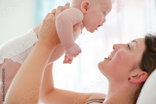 Mother holding baby girl