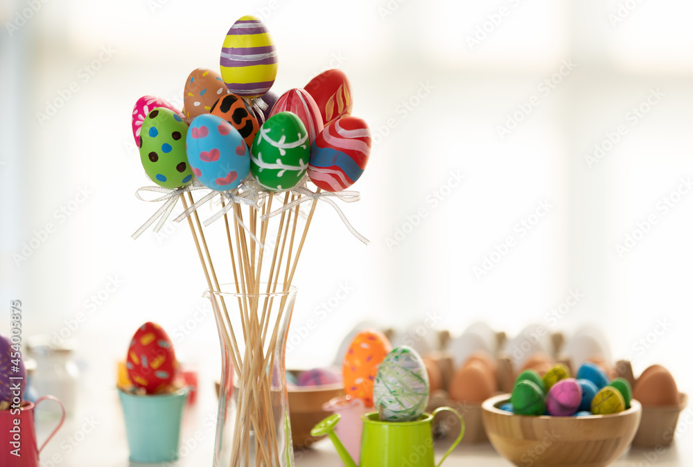 Fototapeta premium Close up of colorful easter eggs Skewers There is a side area for texts. In the concept of Easter eggs with a blurred background technique.