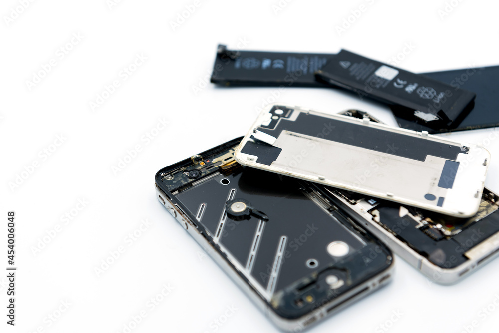 Broken phone, spares, battery is dead, cell phone on white background
Broken phone, spares, battery is dead, cell phone on white background
