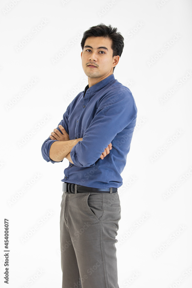 Portrait of Asian businessman in casual business clothes wearing a shirt and slack trousers posing on white background Portrait of Asian businessman in casual business clothes wearing a shirt and slack trousers posing on white background