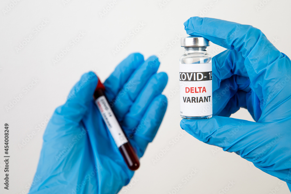 Vaccine bottles covid - 19 delta variant, vials medicine and syringe injection isolated on white. Coronavirus DELTA 2019-ncov. Vaccine bottles on the woman hand Vaccine bottles covid - 19 delta variant, vials medicine and syringe injection isolated on white. Coronavirus DELTA 2019-ncov. Vaccine bottles on the woman hand