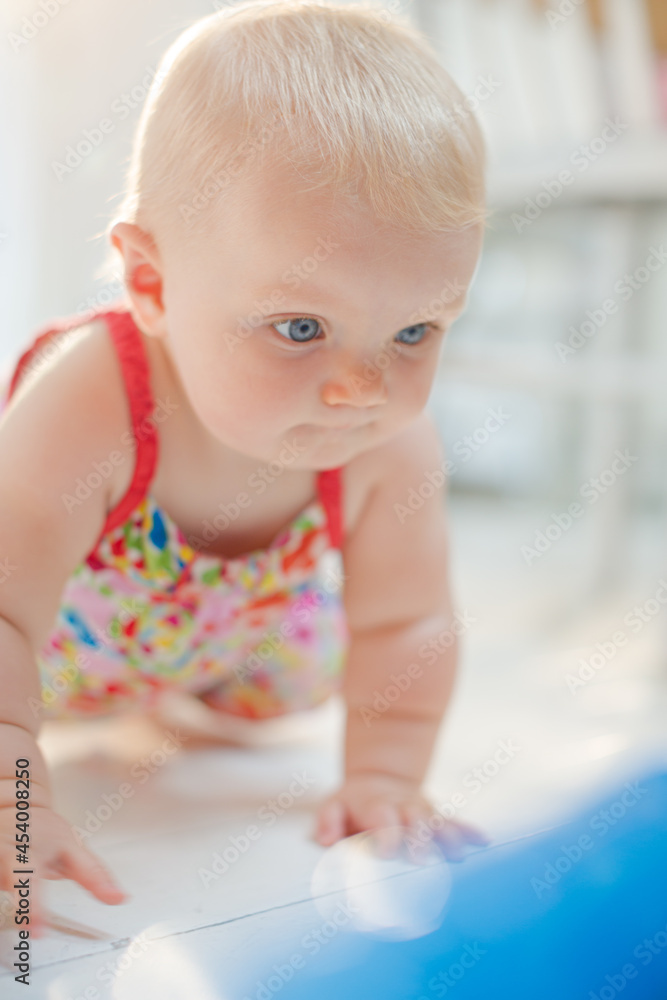 Baby girl crawling on floor Baby girl crawling on floor